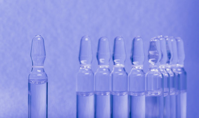 Glass medical ampoule vial for injection. Medicine is liquid sodium chloride with of aqueous...