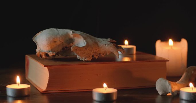 Dark background with candles and skull