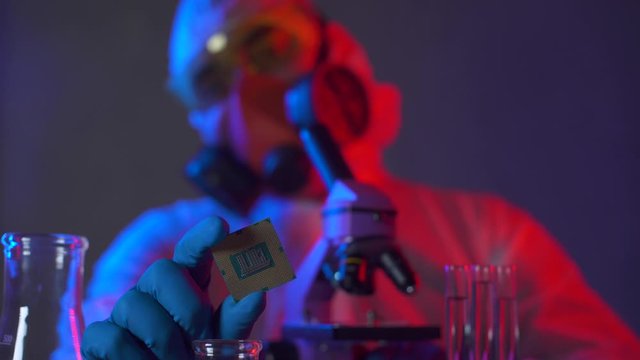 Scientist in scientific laboratory research and test new nanotechnology. Researcher working on developement a electronic system. Science and digital engineering. Biochip technology. Engineer working.