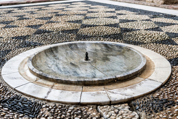 marble fountain of the royal alcazares of seville