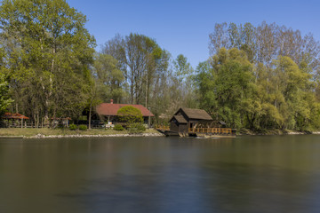 Fototapeta na wymiar Unique Traditional Boat Mill On A River