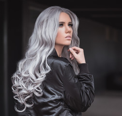 Portrait of beautiful girl with healthy long grey hair outdoor
