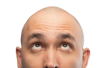Image of bald man looking up, half head - Powered by Adobe