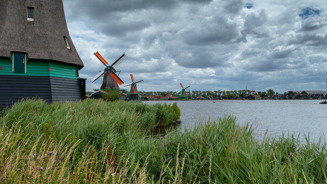 Traditional Windmills along river Zaan, Zaanse Schans, Zaandam, North Holland, Netherlands
