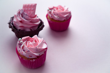 Homemade pastries are decorated with butter cream with colored drops