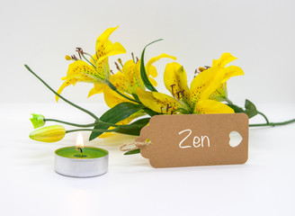 Zen, a yellow flower and a light isolated on white background