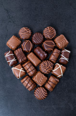Stack of pralines chocolateshape a heart for Valentines day