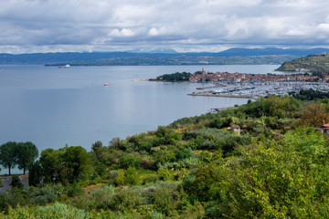 4Aerial view over the sea beautiful Izola town, with old town and harbor