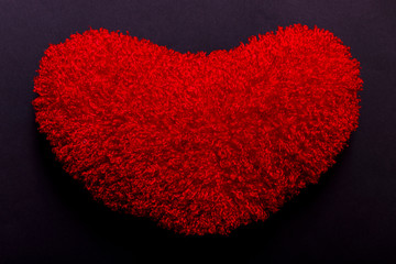 Red heart shape over black background, best surface of the year.