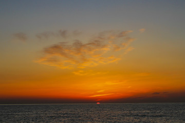 Fototapeta na wymiar beautiful dawn on the sea, flight of ducks over the sea, ducks fly at dawn over the sea.