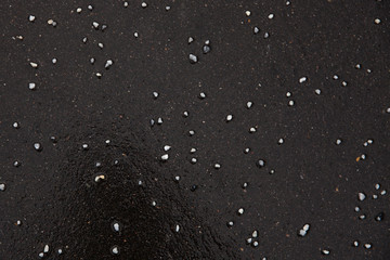 Reagents on dark asphalt in winter