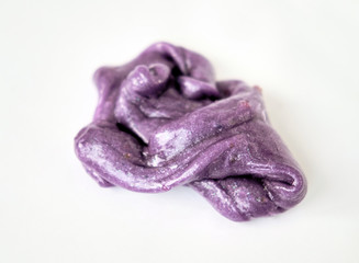 Isolated violet slim lies a pile on a white background