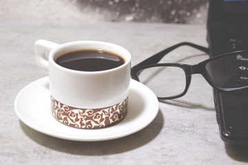 cup of coffee on wooden table