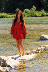 a young woman is having fun on the isar river in munich
