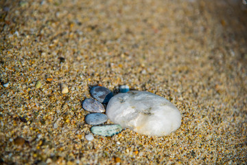 Foot pebbles on the sand