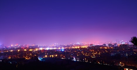 Fototapeta na wymiar ILLUMINATED CITYSCAPE AT NIGHT