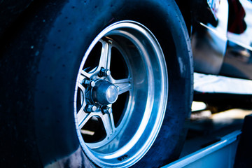 new silver aluminum rim wheel on black background. beautiful concept, close-up. shot in a tire shop