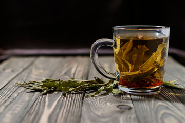 Tea from the herbal collection of narrowleaf cypress and rose hips