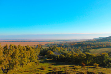 Fototapeta premium A view at a small mountain valley on a nice sunny day.