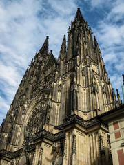 Fototapeta premium The incredible and mystical facade of the ancient Gothic St. Vitus Cathedral in Prague, the capital of the Czech Republic.