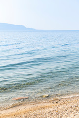 Lake Garda / Lago di Garda / Gardasee, shore line with little waves and sand