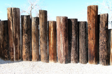 seaside beach wooden poles fence