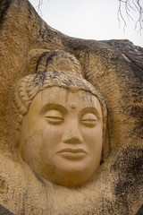 Sculptures carved on sandstones in the Route of the Faces, a hiking route at the shore of Buendia Reservoir, Cuenca, Spain.