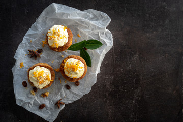 carrot cake cupcake bite size dessert snack homemade baked dessert cream orange peel decoration board composition cafe bistro