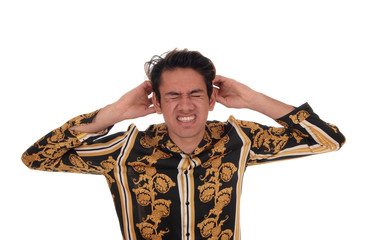 Man with hands on his ears for a terrible head ache