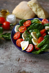 Fresh caprese salad with cherry tomatoes. Healthy salad with basil and mozzarella. Diet food. Keto diet.