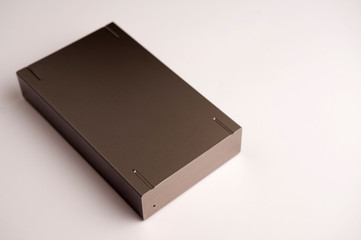 large hard disk of dark aluminum color, on white background