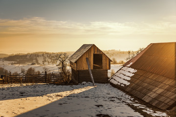 House placed on a hill in a remote area, winter landscape