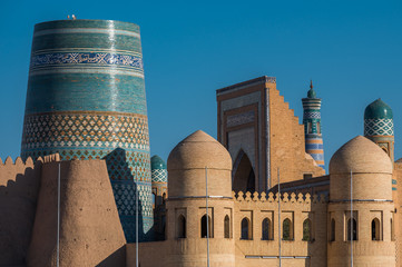 Summer  view of Old City in Khiva, Uzbekistan with unfinished Kalta Minor Minaret with arabic text "This is a wonderful building will stand forever in the joy of future generations"