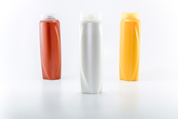 Shampoo bottles photographed on white background. Photographed in a studio setting.