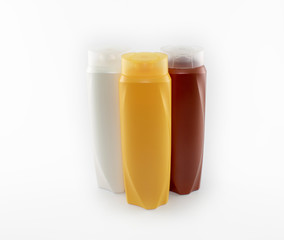 Shampoo bottles photographed on white background. Photographed in a studio setting.