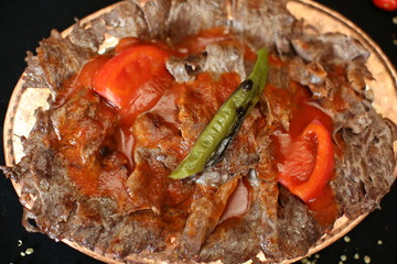 Turkish Doner Kebab with tomato sauce on the dinner plate