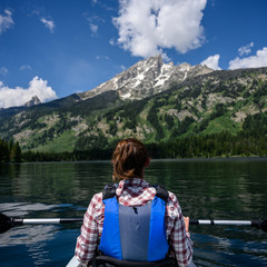Women with Ponytail Kayaking in Mountain Lake