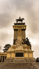 Fototapeta na wymiar Side view of the Monument to Alfonso XII in the Retiro Park, Madrid. Travel concept.