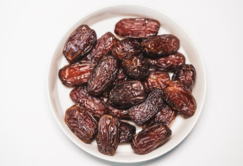 Fresh Medjool Dates on a white plate