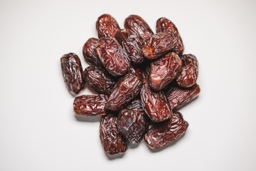 Tropical stone fruit Medjool Dates on a white background
