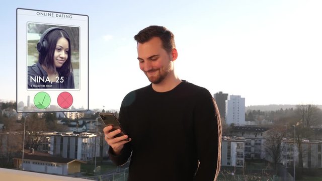 Young man on sunny balcony swipes through a dating app - reject cute girl