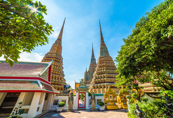 Fototapeta premium Wat Po (Wat Pho), Temple of Reclining Buddha, Royal Monastery, Popular Tourist Attractions in Bangkok, Thailand.