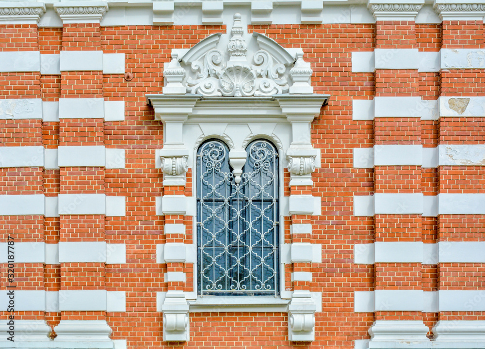 Sticker close-up of ancient vintage arch window with cast iron white lattice, pattern