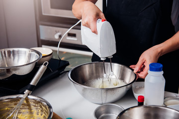 Woman beat dough mixer by machine