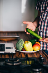 Healthy food, online recipe, culinary video blog. Overweight man blogger recording video in his kitchen