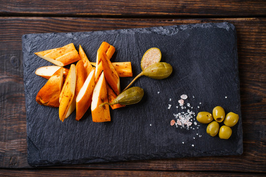 Traditional Caucasian smoked Chechel cheese. Beer snack, tasty food