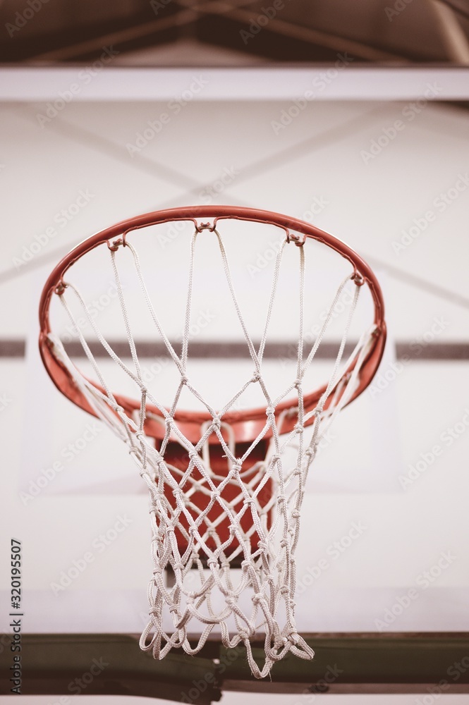 Poster closeup low angle shot of basketball net in the basketball court