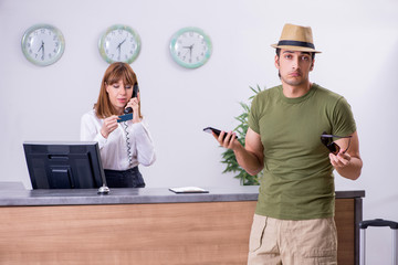 Young man at the hotel reception