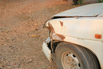 Fototapeta na wymiar Details part of an old rusted crash white car.