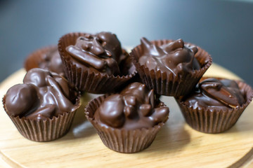 chocolate  praline  with mixed nut background